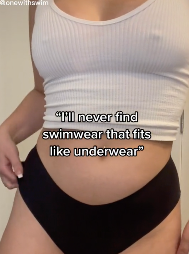 White ribbed tank and black swim bottoms; overlay text I'll never find swimwear that fits like underwear; @onewithswim