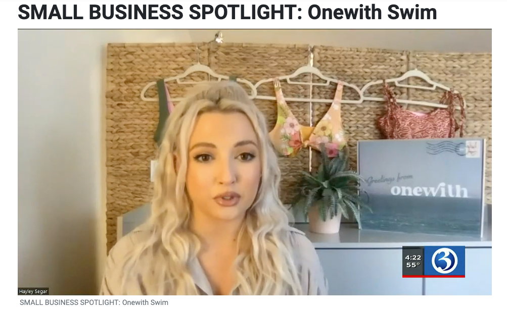 Screenshot of a WFSB Small Business Spotlight interview with a woman, swimsuits on hangers behind her, and a ‘onewith’ sign
