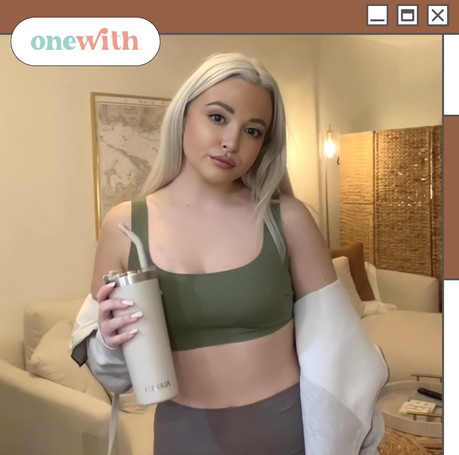 Hayley Segar in olive swim top holding insulated tumbler; onewith logo visible.