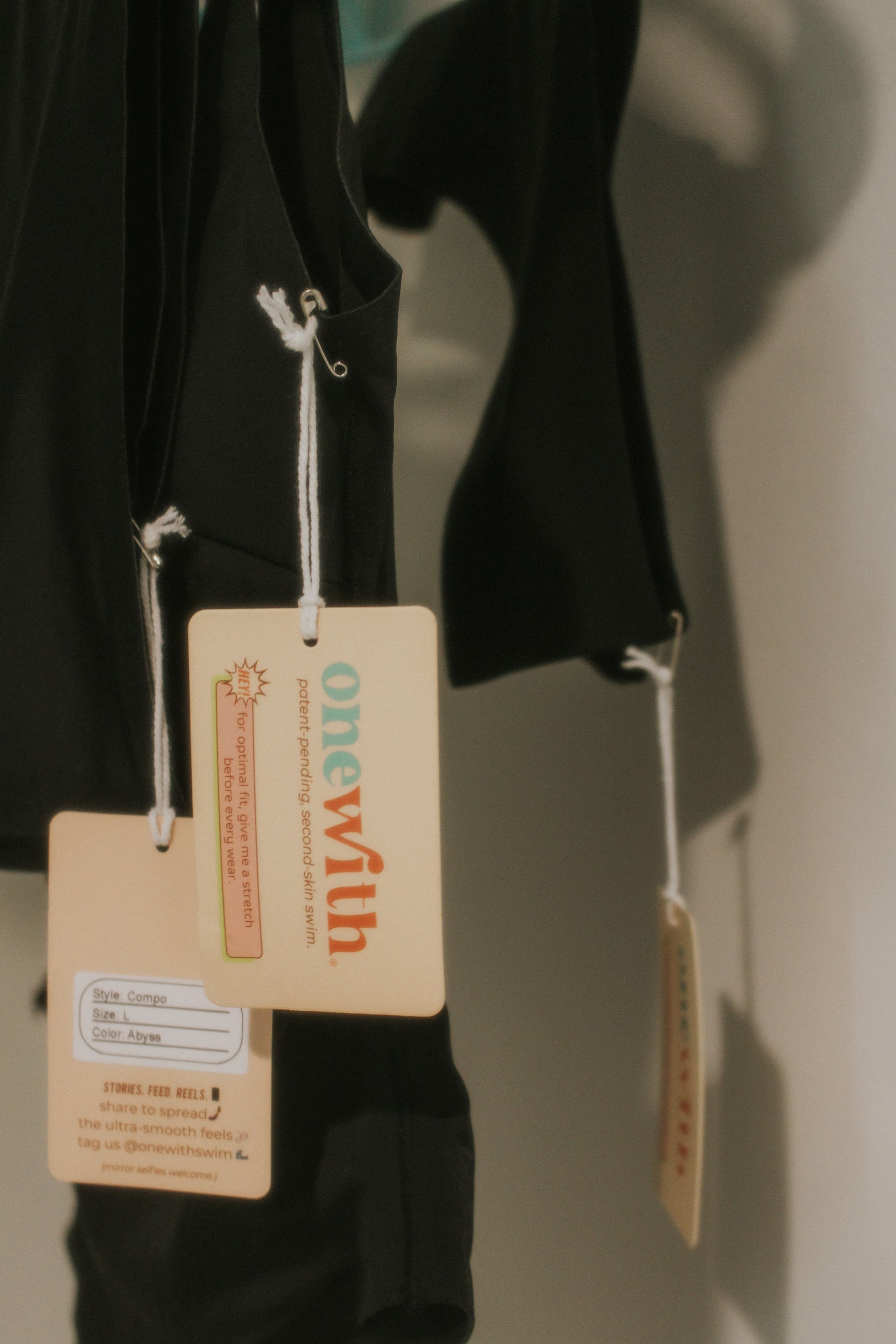 Black swimsuit with tags: onewith; patent-pending, second-skin swim; Style: Compo; Size: L; Color: Abyss