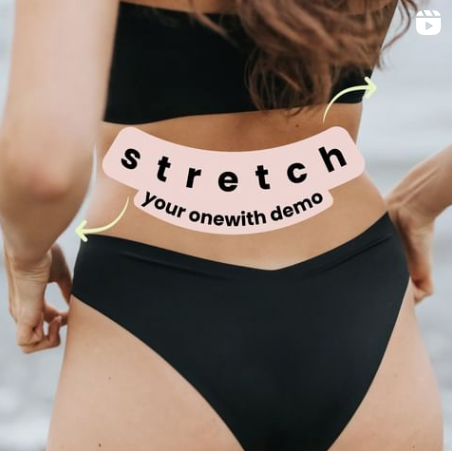 Woman pulling black onewith high-rise bikini bottoms on a beach, large overlay reads 'stretch your onewith demo'