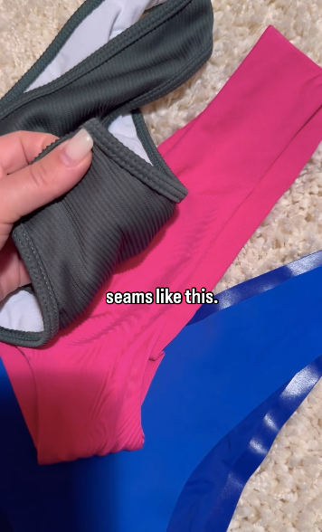 Close-up of onewith swim bikini pieces showing a seam pulling away from the lining with overlay text seams like this