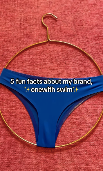 Front view of blue swim bottom on gold circular hanger against red background, overlaid text 5 fun facts about onewith swim