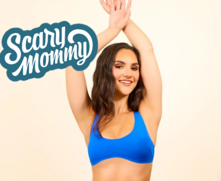 Smiling woman in a blue bikini top with "Scary Mommy" logo in the corner