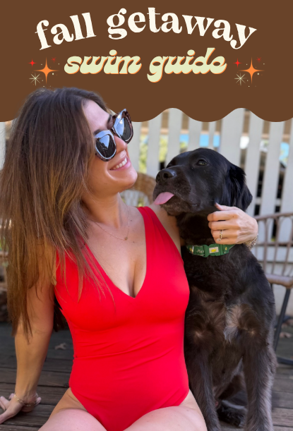 Woman in red one-piece swimsuit seated with black dog; overlay text: 'fall getaway swim guide'