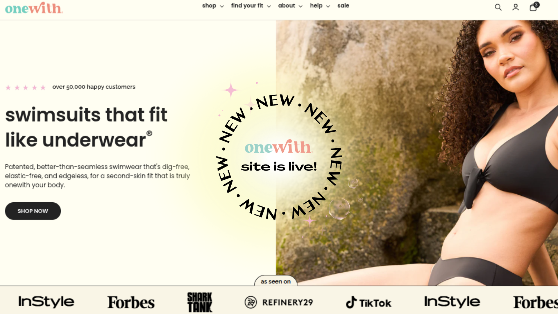 Model in black bikini beside hero banner with 'onewith' site is live badge