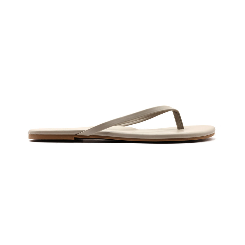 brown thong sandal (flip-flop) on white background, side view.