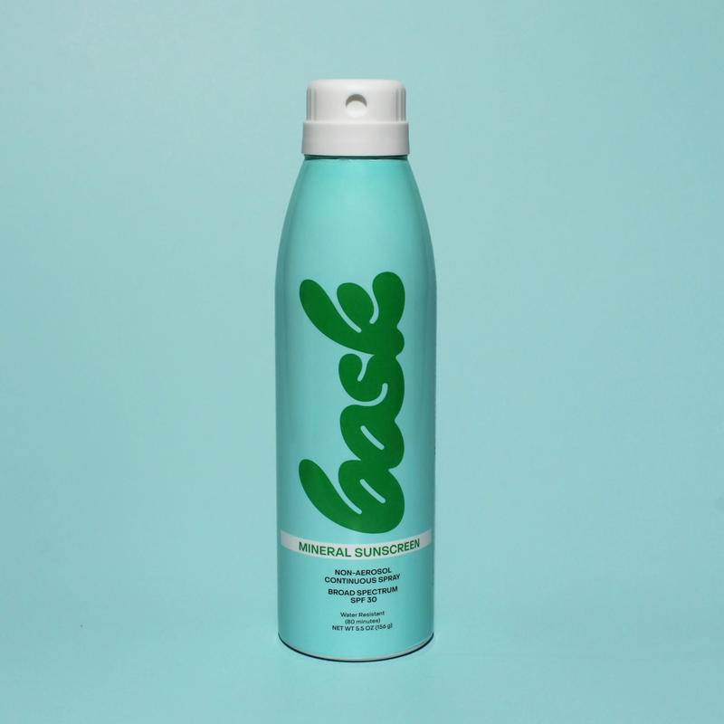 Bask mineral sunscreen aerosol can with green cursive 