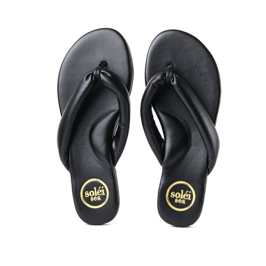 Black rubber flip-flops with toe-post straps and circular heel logos