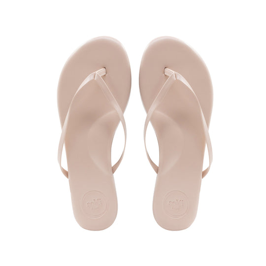 Beige flip-flops with thong straps, top view