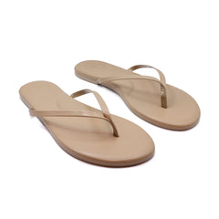 Tan flip-flop sandals with slim toe-post straps and lightly cushioned footbed, angled view.