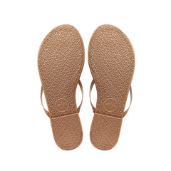 Pair of tan leather sandals with ankle straps, top view