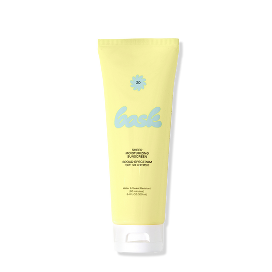 Yellow sunscreen tube with blue bask logo and white flip cap