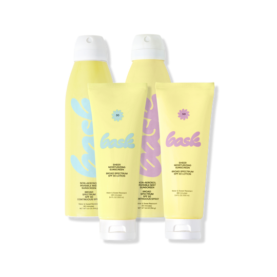 Three yellow sunscreen bottles with white caps and pastel blue and pink labels, arranged side-by-side (product packaging).