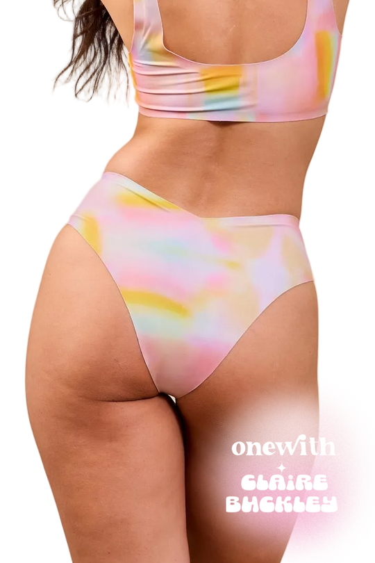 Back view of Jennings V‑Cut high‑waist bikini bottom in pastel tie‑dye, V-back high-rise fit; 'onewith Claire Buckley' overlay | alexhakim16 / M