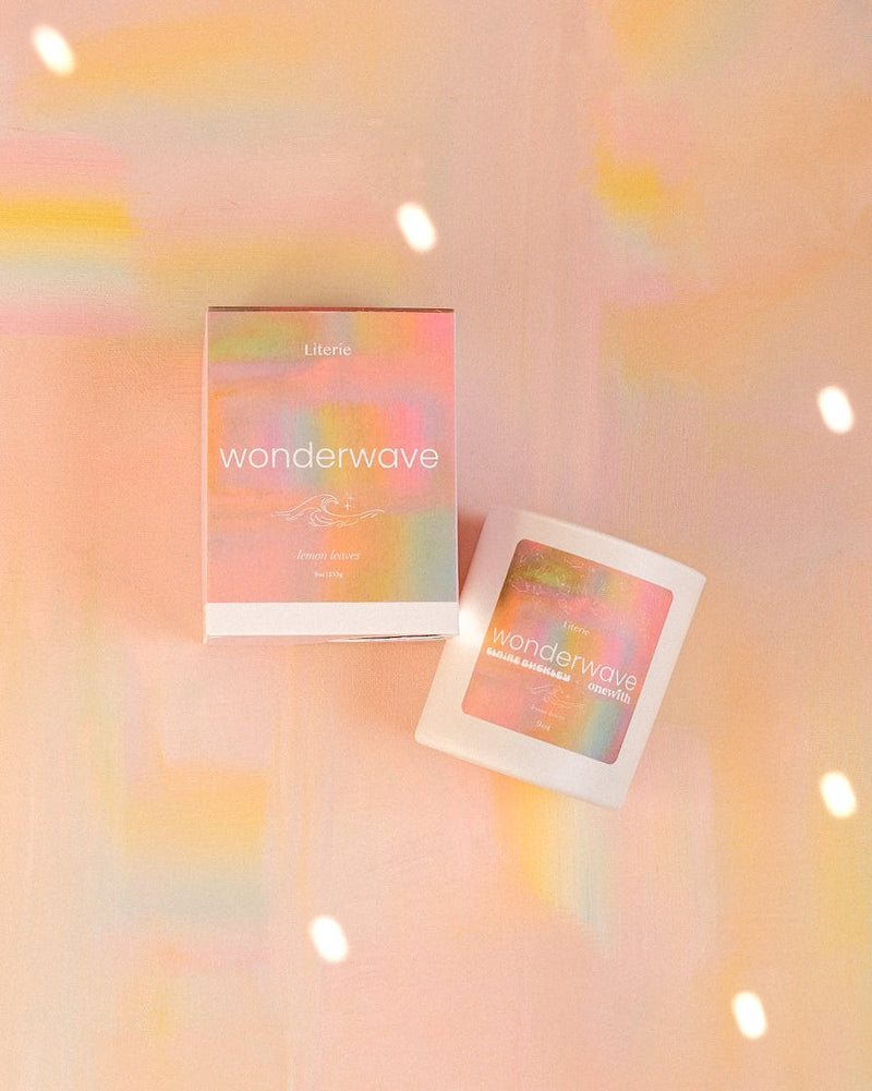 Two overlapping square photo frames on a soft peach background with pastel light flares and floating sparkles.